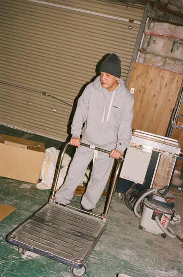Shinjiro wearing vowels Classic Hoodie in Heather